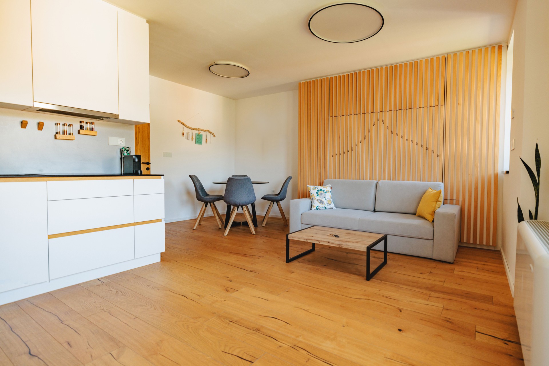 A Nice And Cozy Studio With A Small Living Room And A Kitchen At An Apartment For Rent